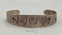 1920s Era Bracelet With Whirling Logs and Other Symbols