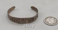 1920s Era Bracelet With Whirling Logs and Other Symbols