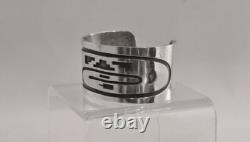 An Early Hopi Bracelet, Sterling Silver Overlay Sikyátki Bird- Dance Wand motif