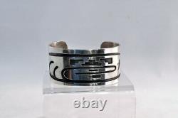 An Early Hopi Bracelet, Sterling Silver Overlay Sikyátki Bird- Dance Wand motif