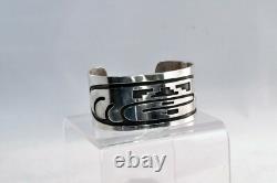 An Early Hopi Bracelet, Sterling Silver Overlay Sikyátki Bird- Dance Wand motif