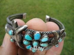 EARLY 1900's ZUNI BRACELET WITH COW HEADS