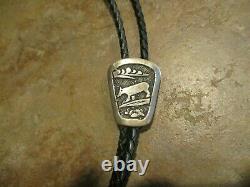 EARLY TOMMY SINGER (d.) Navajo Sterling Silver WOLF STORYTELLER Bolo Tie