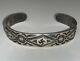 Early 900 Silver Navajo Repousse Stamped Cuff Bracelet With Whirling Log