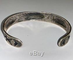 Early 900 Silver Navajo Repousse Stamped Cuff Bracelet with Whirling Log