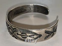 Early 900 Silver Navajo Repousse Stamped Cuff Bracelet with Whirling Log