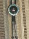 Early Zuni Fred & Lolita Natachu Sterling Mosaic Inlay Sundance Warrior Bolo Tie