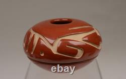 Santa Clara Pueblo Caved Red Seed Jar by Denise Chavarria Early 21st Century