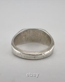 Bague en argent sterling Navajo estampillée et coulée des débuts de l'ère Fred Harvey avec un bouclier en flèche