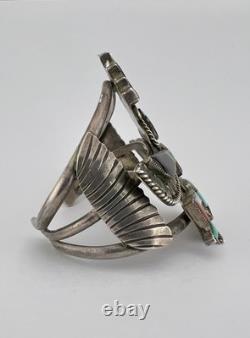 Bracelet large en laiton avec incrustation de plusieurs pierres précieuses Zuni Knifewing de Frank Vacit