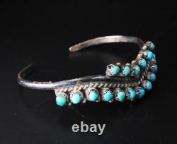 Bracelet manchette en argent sterling vintage du début de l'ère Zuni Harvey avec des yeux de serpent en turquoise