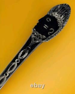 Cuillère-souvenir en argent de pièce/ignot Navajo ancienne de 1900 avec visage amérindien